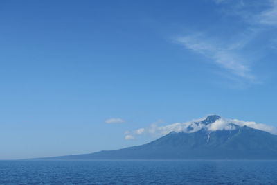 Scenic view of sea against blue sky