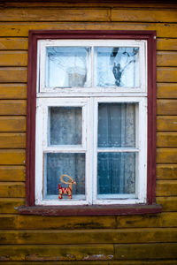 Toy on window of building