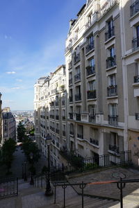 View of buildings in city against sky