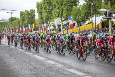 People riding bicycles on street