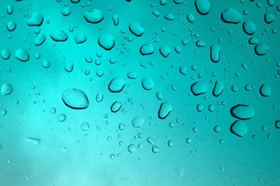 Full frame shot of raindrops on window