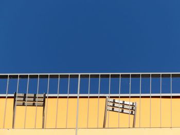 Low angle view of building against clear blue sky