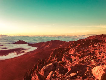 Scenic view of mountains against sky during sunset