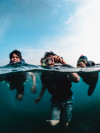 People swimming in sea