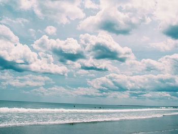 Scenic view of sea against cloudy sky