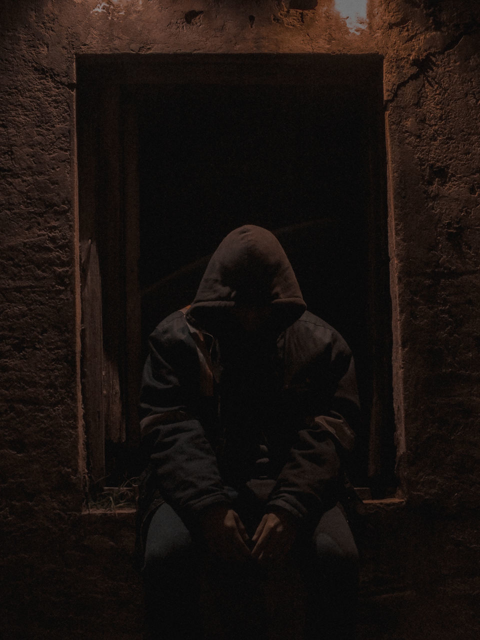 FULL LENGTH PORTRAIT OF MAN SITTING ON FLOOR