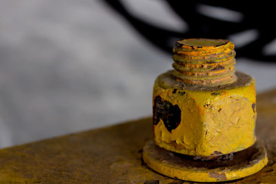 Close-up of rusty metal on table