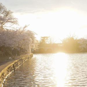 Scenic view of lake against sky during sunset