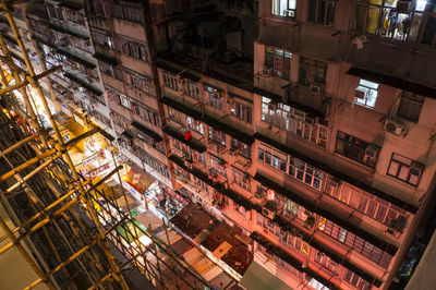 High angle view of illuminated buildings in city at night