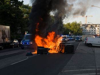 Cars on city against sky