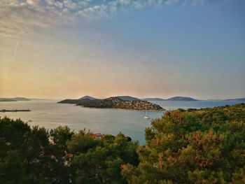 Scenic view of sea and mountains during sunset