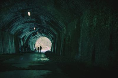 People walking in tunnel