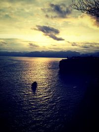 Scenic view of sea against cloudy sky