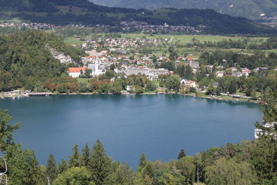 High angle view of lake and buildings in city