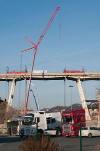 Cranes at construction site against sky