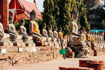 Statues at temple outside building