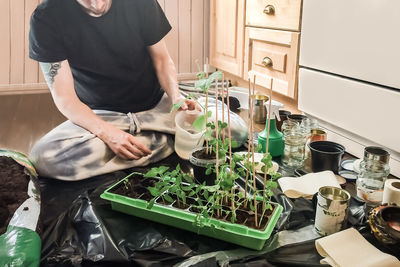 Midsection of man standing at home