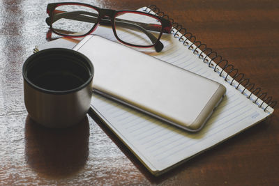 High angle view of coffee cup on table