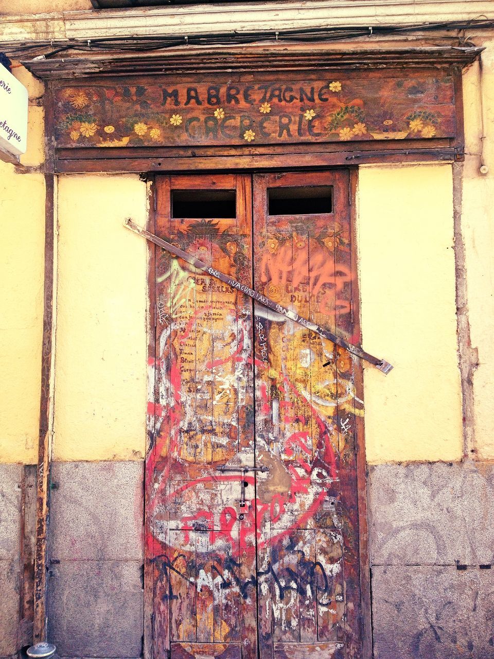 architecture, building exterior, built structure, wall - building feature, door, old, weathered, window, wall, closed, art and craft, house, day, outdoors, brick wall, art, building, creativity, no people, graffiti