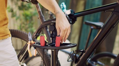 Low section of man riding bicycle