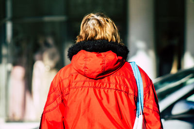 Rear view of woman with red umbrella