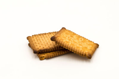 Close-up of bread against white background