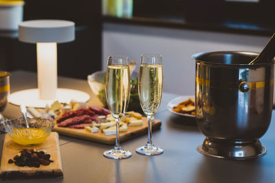 Close-up of wine glasses on table