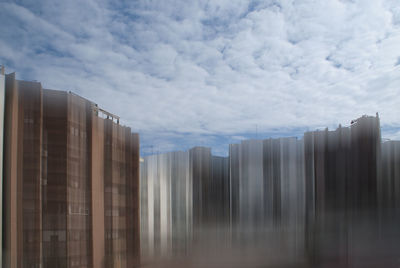 Low angle view of modern buildings against sky