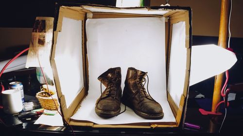 Close-up of shoes in box on table