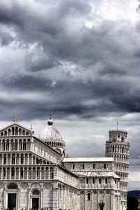 Low angle view of building against cloudy sky