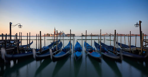 Boats moored in canal