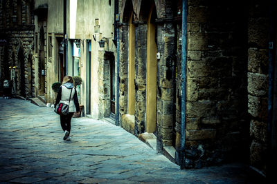 Full length of woman walking on walkway