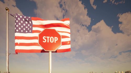 Low angle view of flag against sky