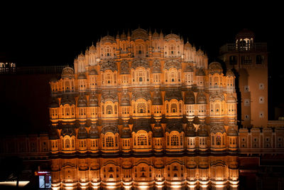 Low angle view of illuminated building at night