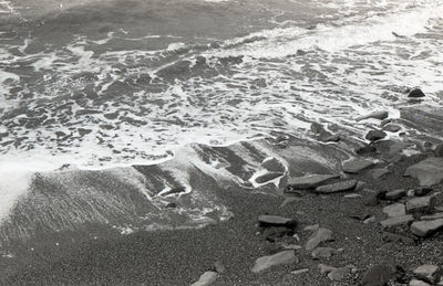 High angle view of surf on beach