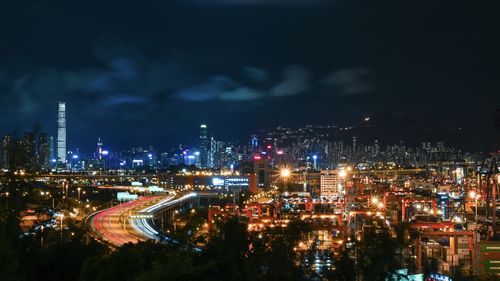 High angle view of illuminated buildings in city at night