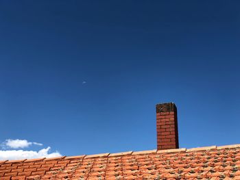 Low angle view of building against blue sky