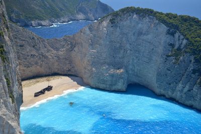 Scenic view of mountain by sea