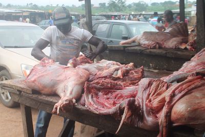 Man preparing food for sale at market