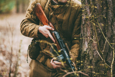 Man holding camera in forest