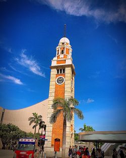 Low angle view of clock tower against sky