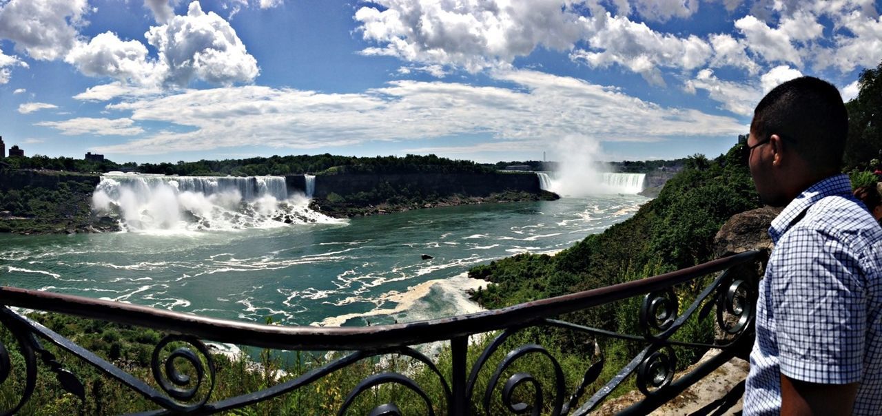 water, lifestyles, motion, leisure activity, sky, waterfall, splashing, men, flowing water, cloud - sky, tourism, travel, standing, surf, tourist, travel destinations, nature, famous place