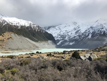 Scenic view of snowcapped mountains against sky