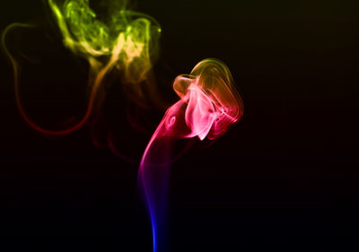 Abstract smoke red green blue gradient color in black background with beautiful motionflow.