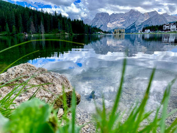 Scenic view of lake and mountains against sky