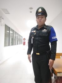 Portrait of man standing in shopping mall