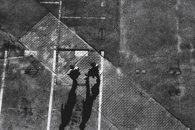 High angle view of people walking on field