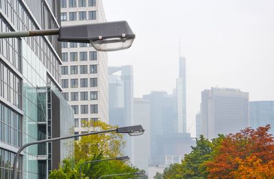 Modern buildings in city against sky