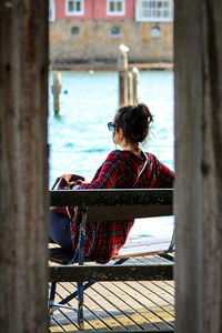 Rear view of woman looking out to sea