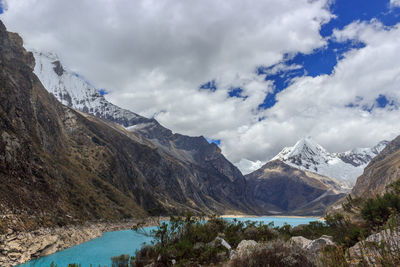 Scenic view of lake and mountains against sky